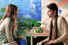 a man and a woman are sitting in front of a window looking at each other