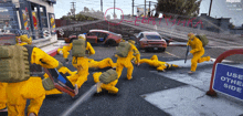 a group of people in yellow jumpsuits are running down the street