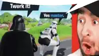 darth vader is talking to stormtroopers in a video game while a man looks on .