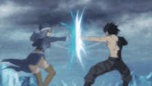 a man and a woman are fighting each other with a sword