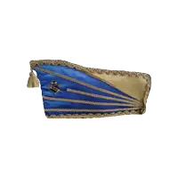 a blue and gold pillow with a tassel and a logo that says ' tdv ' on it