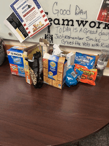 a box of oreos sits on a table next to a box of reese 's peanut butter cups