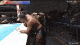two men in a wrestling ring with the words njpwworld on the bottom