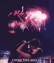 a couple kissing in front of fireworks with the words i wish this was us below them