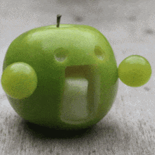 an apple with a face carved into it