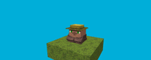 a statue of a person holding a trophy on top of a grass block