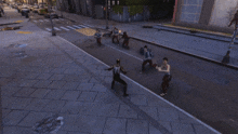 a spider is crawling across a city street with people running