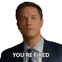 a man in a suit and tie with the words you 're fired below him