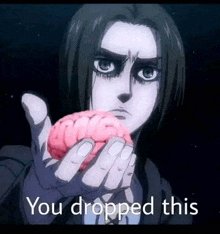 a person is holding a brain in their hand with the words `` you dropped this '' written on it .