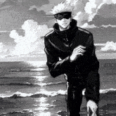 a black and white painting of a man standing on the beach