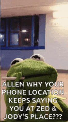 a kermit the frog is holding a cigarette in his mouth while talking to someone .