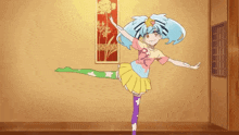 a girl is standing on one leg in a room with her arms outstretched .