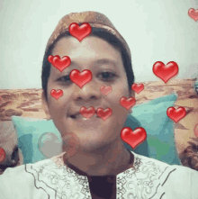 a man is surrounded by red hearts and smiling