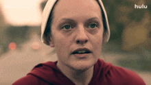 a close up of a woman 's face with hulu written on the bottom right