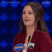 a woman wearing a name tag that says kadeasha
