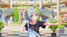 a girl in a black t-shirt is pointing at a sign that says bake