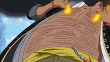 a close up of a person 's stomach with a fire burning on it .