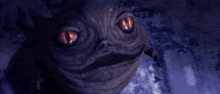 a close up of a creature with red eyes looking at the camera
