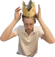 a young boy wearing a burger king crown