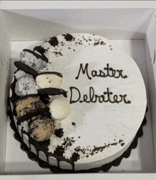 a black and white cake that says master debater