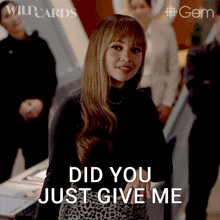 a woman says " did you just give me " while standing in front of a group of people