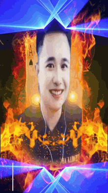 a man with ear buds is smiling in front of a playing card with the ace of spades on it