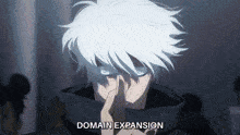 a man with white hair and blue eyes is covering his mouth with his hand and the words domain expansion are visible behind him