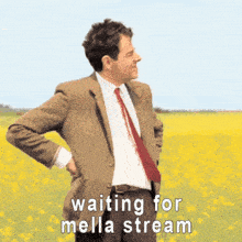a man in a suit and tie is standing in a field with the words " waiting for mella stream " above him
