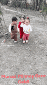 three children are walking down a dirt road with the words murad minnos gece geldi