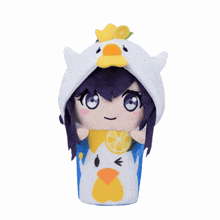 a stuffed animal with a yellow duck on top of its head