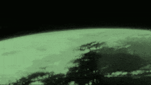 a green and black image of a planet earth