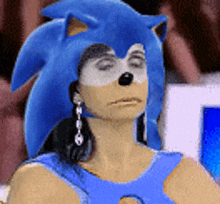 a woman is wearing a sonic the hedgehog hat and earrings