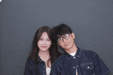 a man and a woman pose for a picture together
