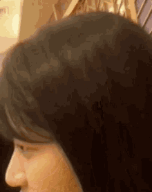 a close up of a woman 's head with a crown on it .