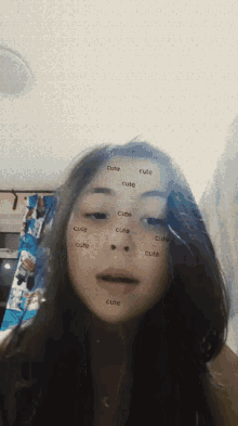 a girl has the word cute on her face