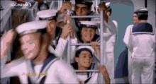 a group of men in sailor uniforms are standing in front of a screen that says cinema 3 on it