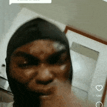 a close up of a person 's face with the number 5667 on the bottom