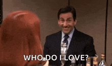 a man in a suit and tie is pointing up at a woman and says `` who do i love '' .