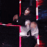 a man in a suit and tie is dancing on stage