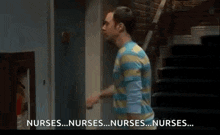 a man in a striped shirt is standing in front of a door talking about nurses .