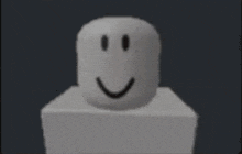 a white smiley face is sitting on top of a white cube .