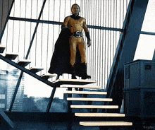 a man in a superhero costume stands on a set of stairs with kepler written on the bottom