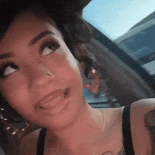 a woman with braces on her teeth is smiling