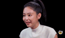 a woman in a white shirt is holding a red object in her hands and eating it .