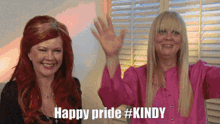two women standing next to each other with the words happy pride #kindy