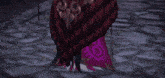 a video game character with a red cape and a sword