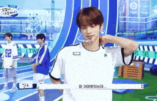 a man in a white shirt with the number 82 on it stands on a track