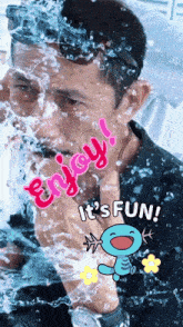 a man is being sprayed with water and the words enjoy it 's fun