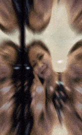 a blurry photo of a woman talking on a phone