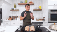 a man in an apron stands in front of a frying pan that says made in animotica on it